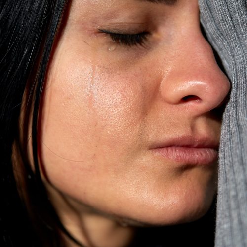 close up of unhappy crying woman